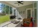 Relaxing screened porch with outdoor seating, a ceiling fan, and a grill for outdoor cooking at 101 Caleb Ct, Ladson, SC 29456