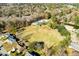 Aerial shot of the community showing the pool, ball field, tennis courts, and surrounding residential area at 102 Ashborough Ave, Summerville, SC 29485