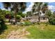 Inviting backyard boasts a refreshing pool, lush landscaping, and brick detailing, perfect for outdoor relaxation at 102 Ashborough Ave, Summerville, SC 29485