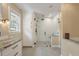 Modern bathroom features a beautiful tiled shower, storage and granite countertops at 102 Ashborough Ave, Summerville, SC 29485