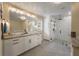 Bathroom features a double vanity, glass shower, and modern fixtures at 102 Ashborough Ave, Summerville, SC 29485