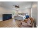 Bedroom features an upholstered bed, ceiling fan, two windows and furniture at 102 Ashborough Ave, Summerville, SC 29485