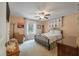 Cozy bedroom featuring a wrought iron bed frame and natural lighting from the window at 102 Ashborough Ave, Summerville, SC 29485