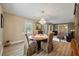 Dining room with a round wood table, chandelier, and views of living room at 102 Ashborough Ave, Summerville, SC 29485