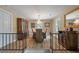 Dining room features beautiful hardwood floors, stylish chandelier, and ample natural light at 102 Ashborough Ave, Summerville, SC 29485