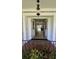 Welcoming entryway featuring double doors, a stylish light fixture, and a glimpse of the home's interior at 102 Ashborough Ave, Summerville, SC 29485