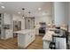 Bright kitchen with white cabinets, stainless steel appliances, and a marble island at 102 Ashborough Ave, Summerville, SC 29485