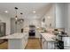 Modern kitchen with white cabinets, stainless steel appliances, and marble countertops at 102 Ashborough Ave, Summerville, SC 29485