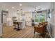 Well-lit kitchen with white cabinets, stainless steel appliances and eat in nook at 102 Ashborough Ave, Summerville, SC 29485