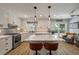 Bright kitchen featuring white cabinets, stainless steel appliances, and a marble island at 102 Ashborough Ave, Summerville, SC 29485