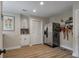 Kitchenette features a stainless steel refrigerator, sink, and ample cabinet space at 102 Ashborough Ave, Summerville, SC 29485