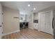 Laundry room features appliances, a sink, white cabinets, and wood flooring at 102 Ashborough Ave, Summerville, SC 29485