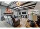 Bright living room with fireplace, wood beams, skylights, and modern furniture at 102 Ashborough Ave, Summerville, SC 29485
