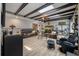 Open-concept living room featuring a skylight, exposed wood beams, and stylish furnishings at 102 Ashborough Ave, Summerville, SC 29485