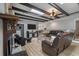 Open living room with wood beams, fireplace, and views to the dining area at 102 Ashborough Ave, Summerville, SC 29485