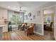 Bright breakfast nook featuring wicker chairs, light walls and trim, and a large window at 102 Ashborough Ave, Summerville, SC 29485