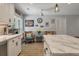 Cozy breakfast nook with a window view, wicker chairs, and bright decor at 102 Ashborough Ave, Summerville, SC 29485