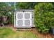 Well-maintained storage shed with double doors, perfect for organizing tools and outdoor equipment at 102 Ashborough Ave, Summerville, SC 29485
