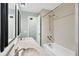Bathroom with double sink vanity, full-sized tub, and tiled shower at 1027 E Recess Rd, Hanahan, SC 29410