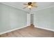 This bedroom features wood flooring and a ceiling fan for maximum comfort at 1027 E Recess Rd, Hanahan, SC 29410