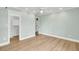Bright bedroom featuring a closet and wood-look floors at 1027 E Recess Rd, Hanahan, SC 29410