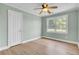 Bright bedroom featuring a window and wood-look floors at 1027 E Recess Rd, Hanahan, SC 29410
