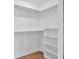 Walk-in closet with ample shelving and modern wood look floors at 1027 E Recess Rd, Hanahan, SC 29410