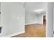 Open entryway leading to the dining and living areas featuring sleek wood floors at 1027 E Recess Rd, Hanahan, SC 29410