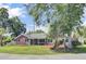 Attractive brick home with lush landscaping providing privacy and curb appeal at 1027 E Recess Rd, Hanahan, SC 29410