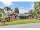 Classic brick home with well-maintained lawn and mature trees adding to its charm at 1027 E Recess Rd, Hanahan, SC 29410