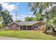 Well-maintained brick home with a neatly kept lawn and a welcoming facade at 1027 E Recess Rd, Hanahan, SC 29410