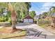 Spacious two-car garage with a private driveway and mature landscaping at 1027 E Recess Rd, Hanahan, SC 29410