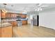A kitchen view showcasing stainless steel appliances, wood cabinets, and plenty of natural light at 1027 E Recess Rd, Hanahan, SC 29410