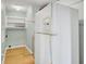 View of a laundry area with a white refrigerator and built-in shelving at 1027 E Recess Rd, Hanahan, SC 29410
