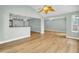 A view of the open-concept living area, highlighting hardwood floors and the connection to the kitchen at 1027 E Recess Rd, Hanahan, SC 29410