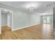 Open concept living room with luxury vinyl plank flooring and ample natural light at 1027 E Recess Rd, Hanahan, SC 29410
