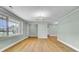Bright, airy living room with big windows and luxury vinyl plank flooring throughout at 1027 E Recess Rd, Hanahan, SC 29410