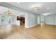 Bright and open living space with kitchen access and luxury vinyl plank flooring at 1027 E Recess Rd, Hanahan, SC 29410