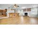 Spacious living room featuring fireplace and open layout with luxury vinyl plank flooring at 1027 E Recess Rd, Hanahan, SC 29410
