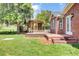 Backyard wooden deck and pergola featuring a seating area and brick steps at 1027 E Recess Rd, Hanahan, SC 29410