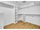 Walk-in closet with custom shelving and hanging racks at 1027 E Recess Rd, Hanahan, SC 29410