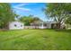 Large backyard with green grass, a detached shed, mature trees, and plenty of room to play at 105 Bermuda Ct, Summerville, SC 29485