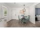 Dining area with new chandelier and hardwood floors at 105 Bermuda Ct, Summerville, SC 29485