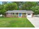 Charming brick home with a well-manicured lawn and a welcoming light blue front door at 105 Bermuda Ct, Summerville, SC 29485