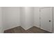 A clean, minimalist hallway featuring modern, neutral color palette, new flooring, and updated baseboards at 105 Bermuda Ct, Summerville, SC 29485