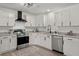 Modern kitchen with white cabinets, stainless steel appliances, and granite countertops at 105 Bermuda Ct, Summerville, SC 29485