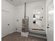 Spacious laundry room features modern water heater, washer/dryer hookups, and leads into a bright, updated kitchen at 105 Bermuda Ct, Summerville, SC 29485