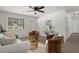 Bright living room with a comfy white sofa, accent chairs and a large window that brings in natural light at 105 Bermuda Ct, Summerville, SC 29485