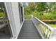 A bright, spacious balcony with white railings and a view of the surrounding greenery at 1055 Royalist Rd, Mount Pleasant, SC 29464
