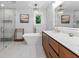 Bright bathroom featuring a soaking tub, a glass-enclosed shower, and modern fixtures at 1055 Royalist Rd, Mount Pleasant, SC 29464
